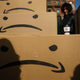 Boxes with the Amazon logo turned into a frown face are stacked up after a protest against Amazon in the Long Island City neighborhood of the Queens borough on November 14, 2018 in New York City.